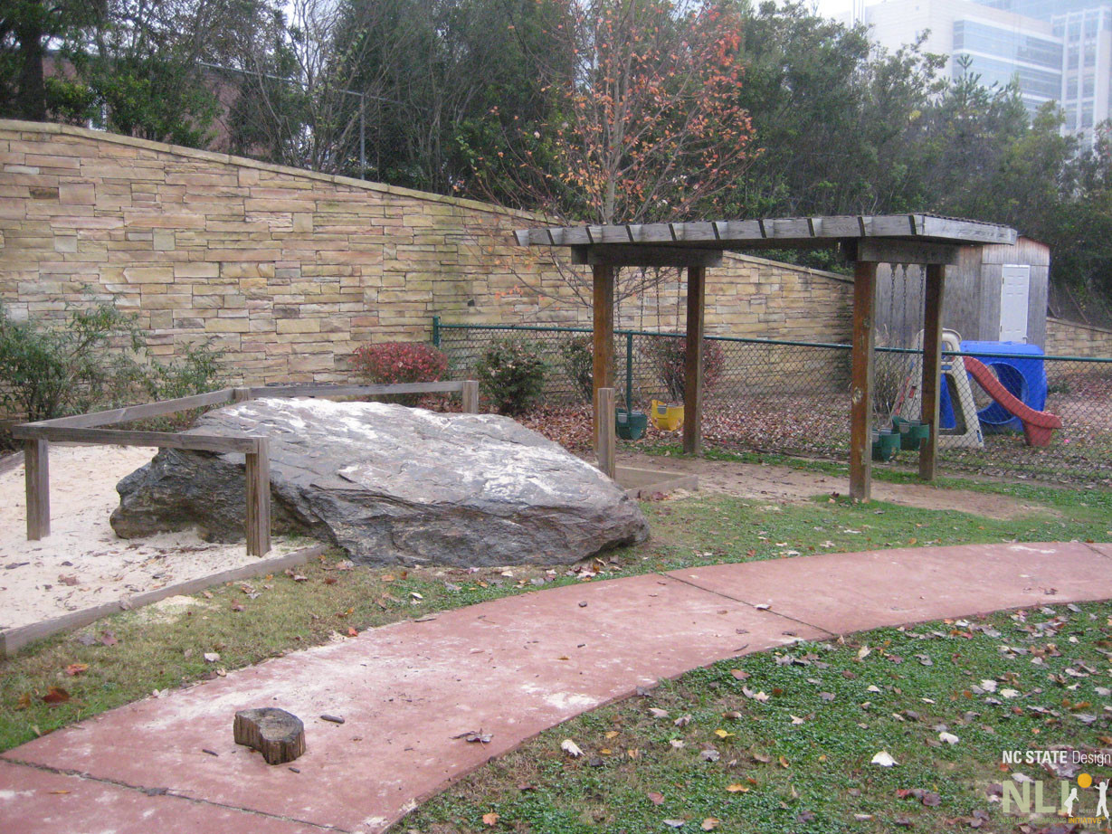 pathway with large rock for play