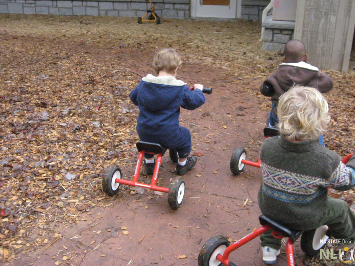 children on wheeled toys