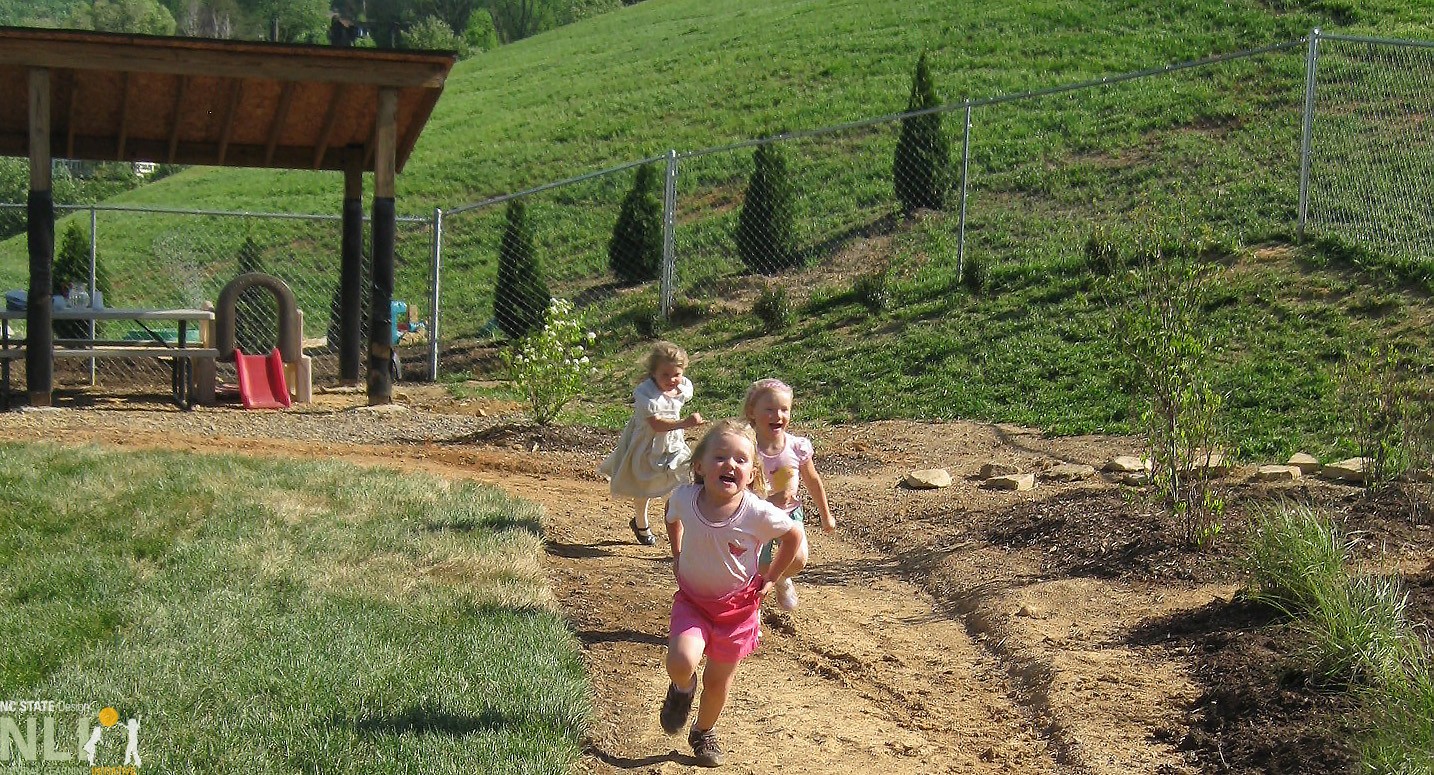 children running on dirt pathway