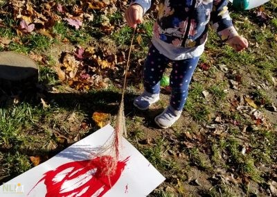 child painting with a plant