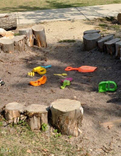 earth play setting with natural and manufactured materials