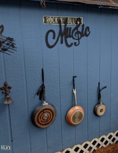 different pots attached to a music wall