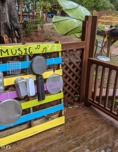 acoustic play items attached to a wooden pallet