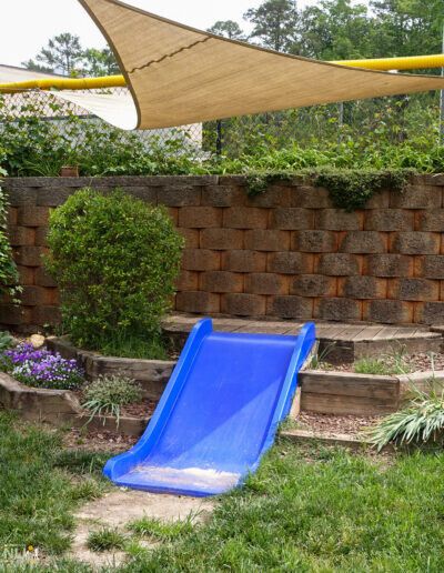 slide for toddles with a shade sail covering