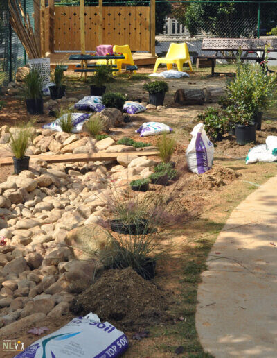 dry creek bed next to primary pathway
