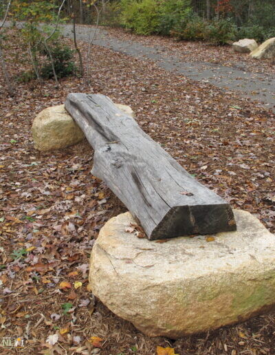 horizontal log on stones
