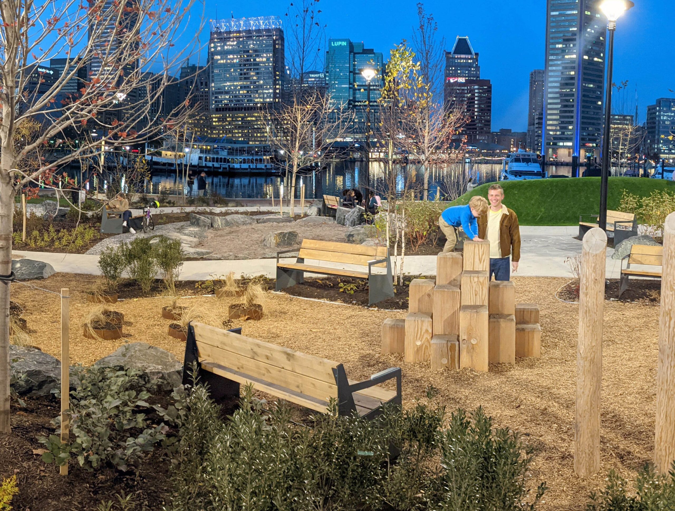 Rashfield 1 child climbing logs with parental supervision