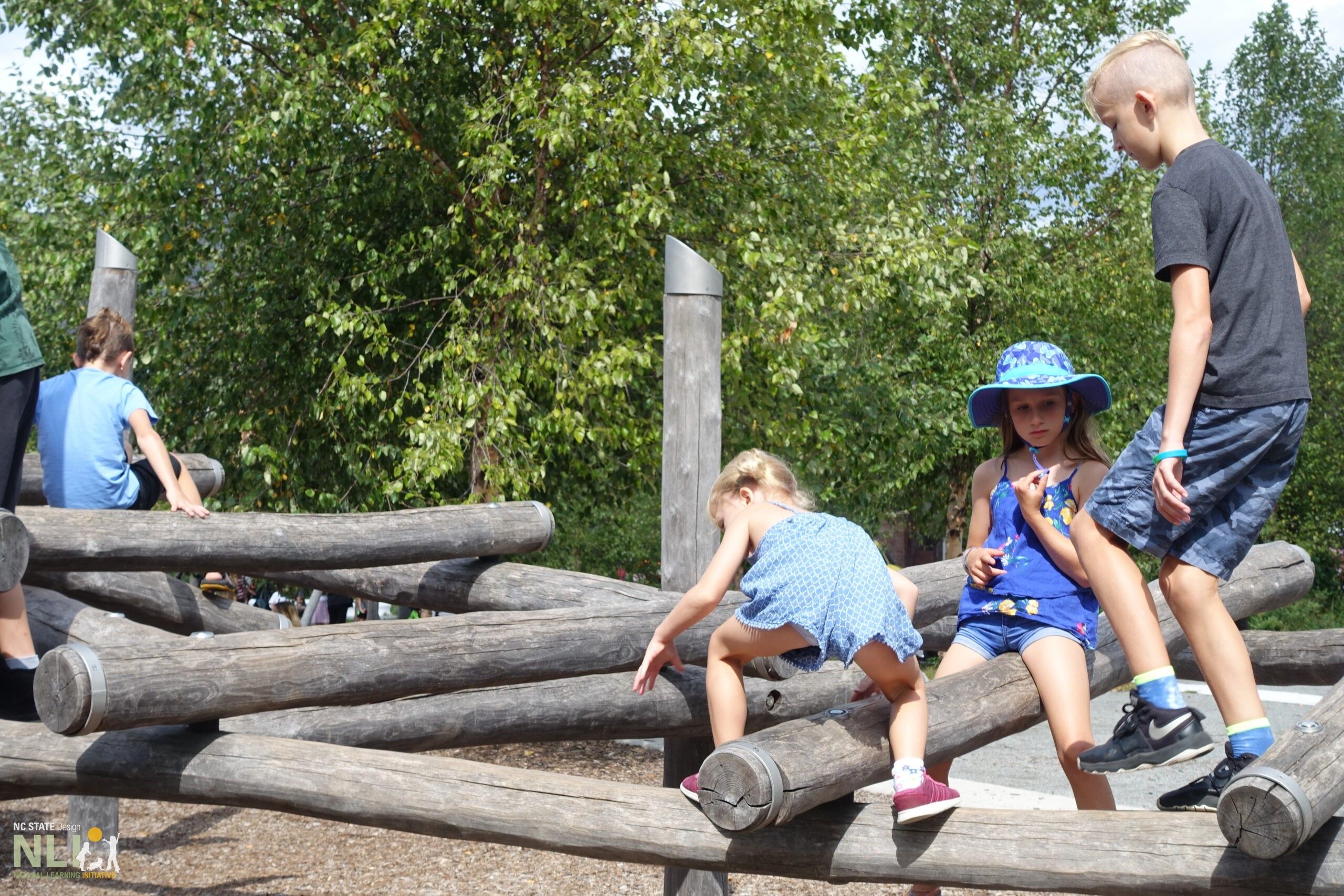 children on a wooden climbing structure