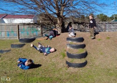 children rolling down a hill with built-in tires