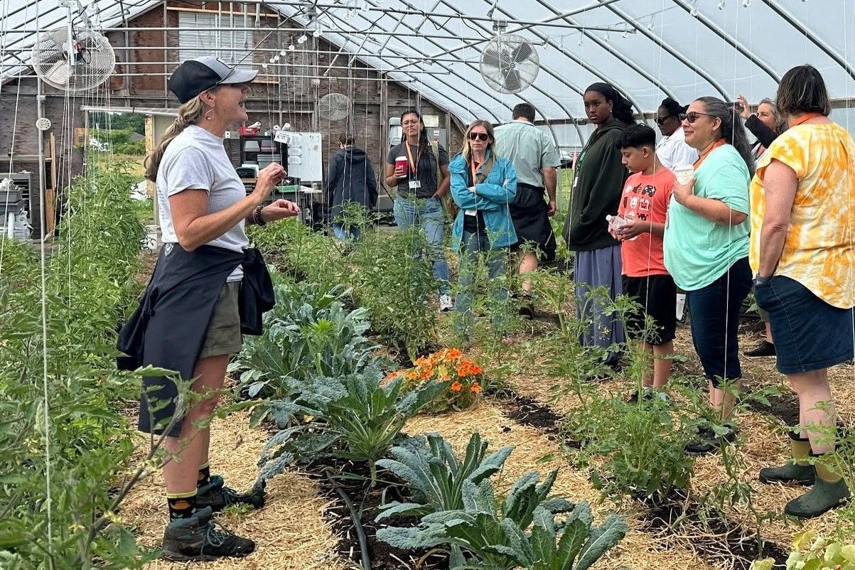 Rhode Island Farm & Sea to School Institute attendees watch a greenhouse presentation